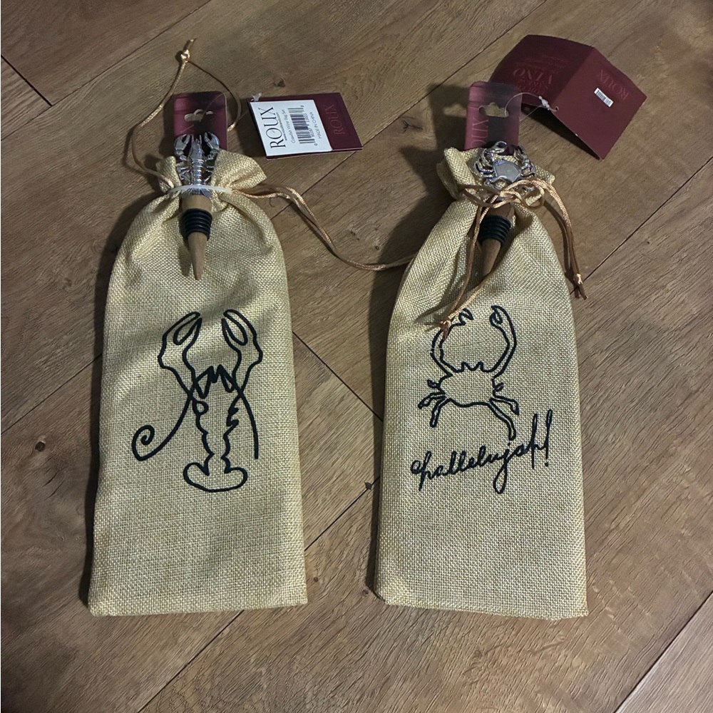 Two Wine holder gift bags with a wine cork. One crab and one crawfish.